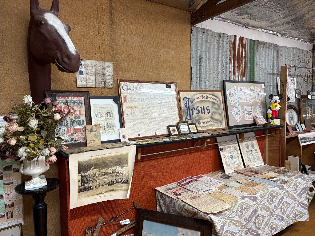 Horse statue with stuffed animals and auction signage